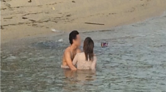 Couple Touching Each Other At Sentosa Beach