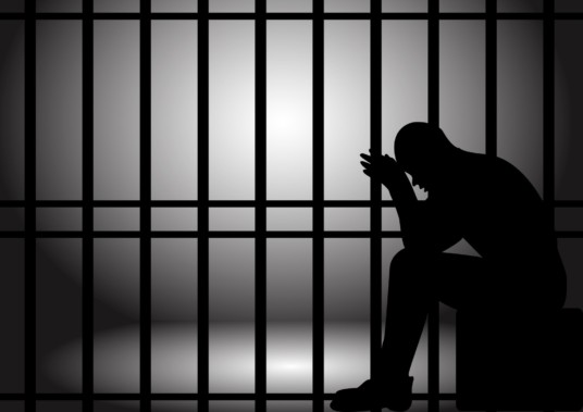 Husband jailed for punching a man in his bedroom