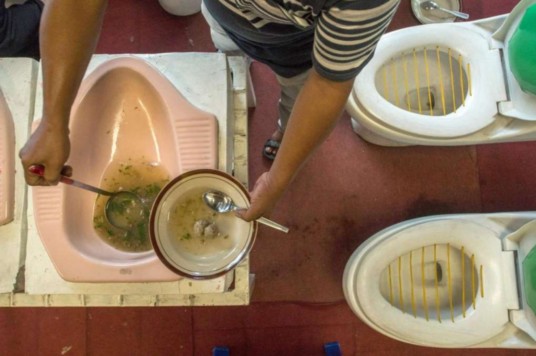 Restaurant serve food and drink from toilet bowl. Eww