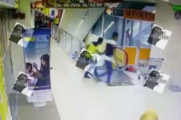 Toddler fall from father shoulder while taking the escalator