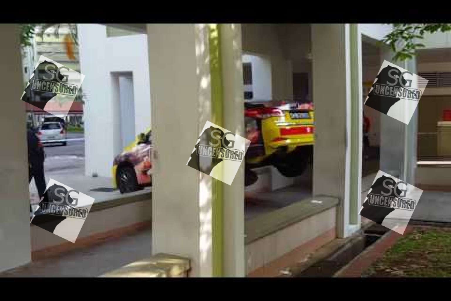 Taxi at crashes into  Jurong West void deck