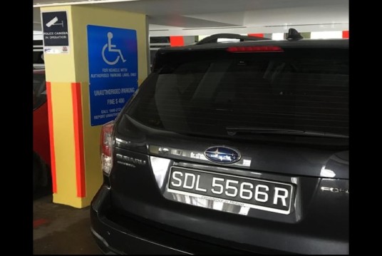 GUYS CLAIMS HANDICAPPED SLOT AT CAR PARK ALWAYS TAKEN