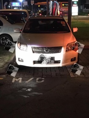 Inconsiderate driver ignore car parking lots and park car at motorcycle lot