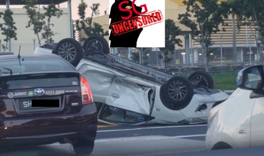 WHITE CAR NEAR EXPO ACCIDENT AND TURNED TURTLE.