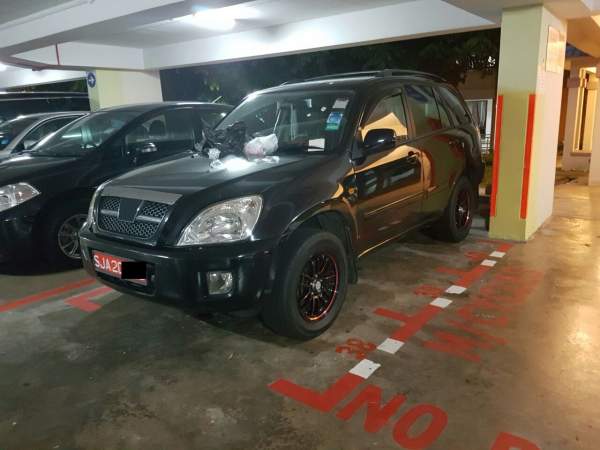 CAR OCCUPIES MOTORCYCLE LOTS AT Woodlands Circle carpark AND GET RUBBISH THROWN ON IT!