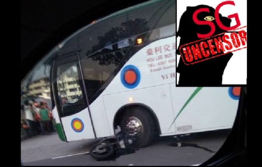PASSENGER BUS RUNS OVER MOTORIST. MOTOR STUCK UNDER THE BUS