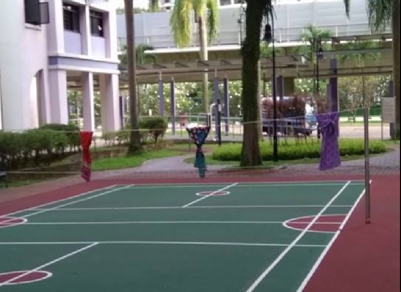 WOODLAND RESIDENTS USE BADMINTON COURT TO HANG WET SMELLY CLOTHES.