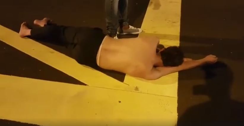 HALF-NAKED DRUNK SLEEPING IN MIDDLE OF ROAD. LUCKY GOT PEOPLE HELP (VIDEO)