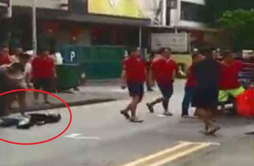 FIGHT AT GEYLANG LORONG 9. MAN INJURED AND UNCONSCIOUS.