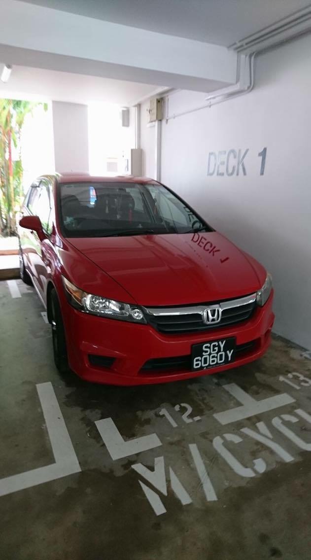 Big motocycle take up 2 motocycle parking lot