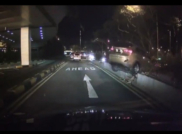 CAR RUNS OVER NOT 1 KERB BUT 2 KERBS AT TERMINAL 2