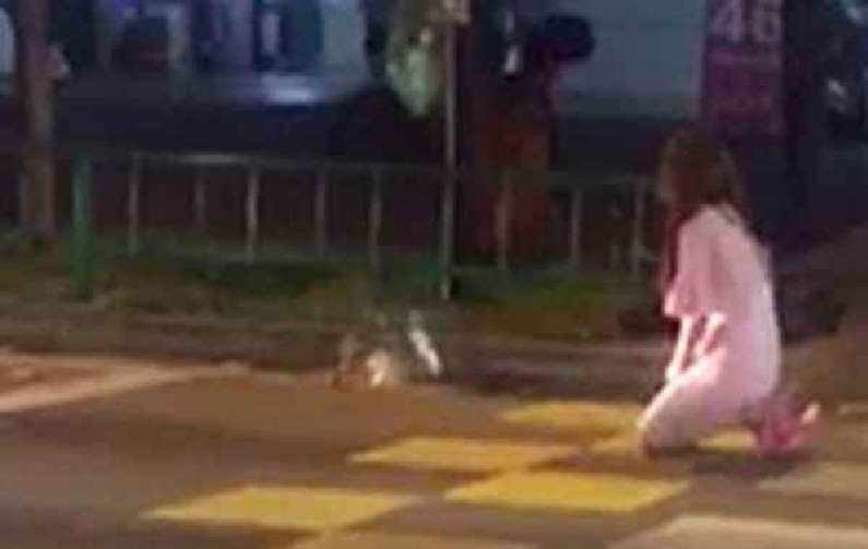 WOMAN KNEEL IN MIDDLE OF ROAD AT NIGHT ASKING FOR BABY GIRL