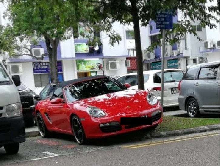 SPORTS CAR AT PARKS AT ON THE MOTOR CYCLE LOT AT BEDOK POINT!