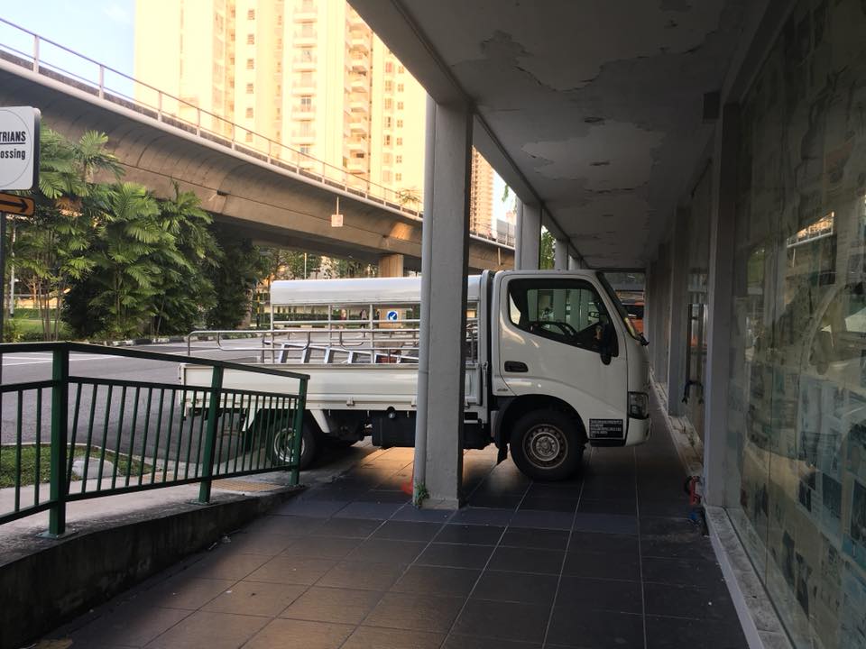 FRUSTRATED MOM WITH STROLLER HAS TO DEAL WITH ILLEGAL PARKED LORRY IS FEELING HELPLESS!