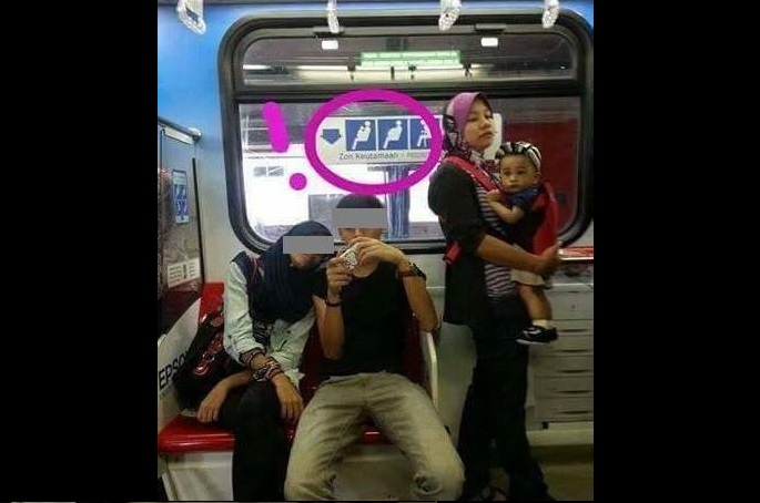 WOMAN WITH CHILD HAS TO STAND WHILE NO ONE GIVE UP THEIR SEATS!