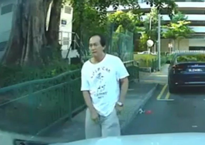 MAN PEE ON CAR ON AT CHAN CHARN ROAD IN BROAD DAYLIGH