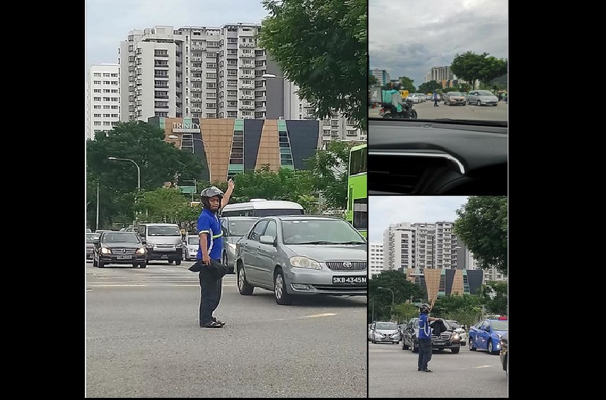 HELPFUL MAN DIRECTS TRAFFIC AFTER TRAFFIC LIGHTS WENT DEAD