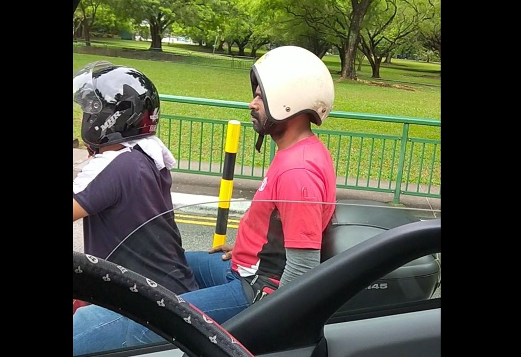 MAN WEAR HELMET WRONGLY AT ORCHARD ROAD