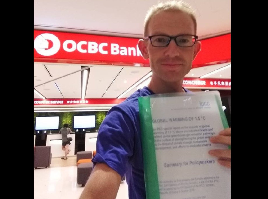 MEN WENT TO BANK RETAIL OUTLET TO DISCUSS CLIMATE CHANGE. WRONG PLACE?