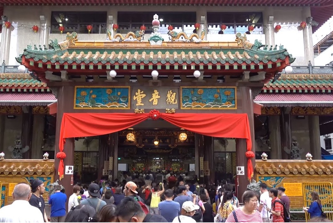 WATERLOO TEMPLE. PRC WOMAN BEGGING FOR MONEY TO BUY RICE
