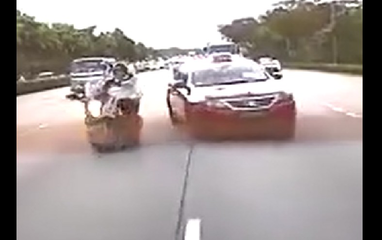 TAXI LOSES CONTROL AFTER HITTING MOTORCYCLE!