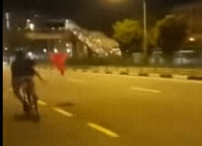 PUNKS THROW CONE ON ROAD TO BLOCK CARS. NABEI