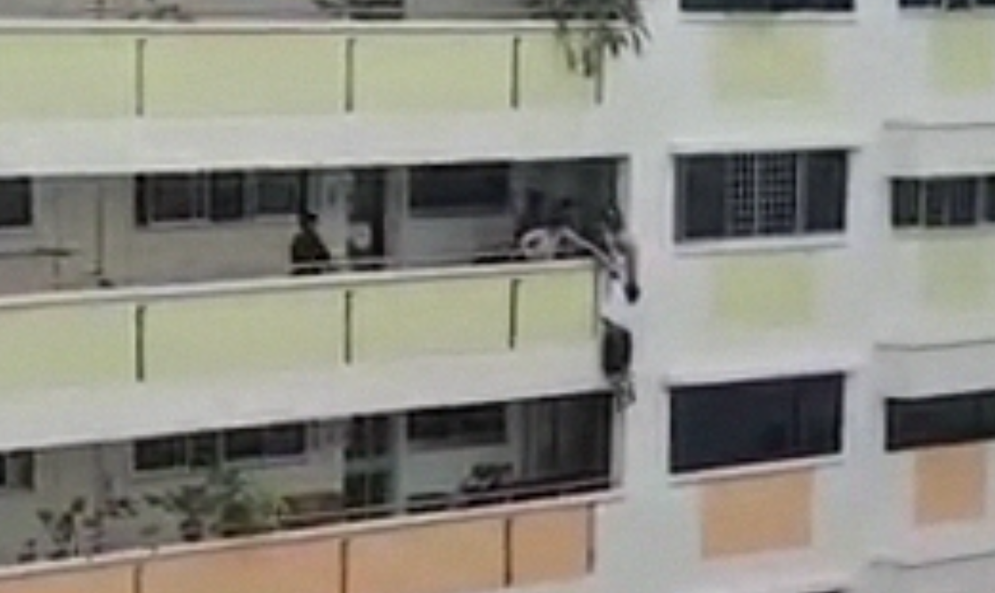 POLICE SAVING WOMAN HANGING ON THE EDGE OF HDB