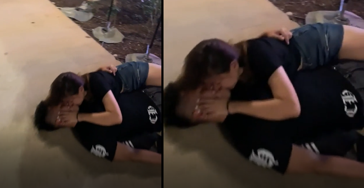 DRUNK COUPLE SPOTTED KISSING OUTSIDE A PUB ON THE FLOOR
