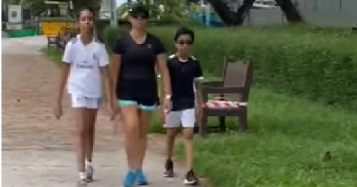 FAMILY OF 3 SPOTTED WITHOUT FACE MASK OUTDOORS