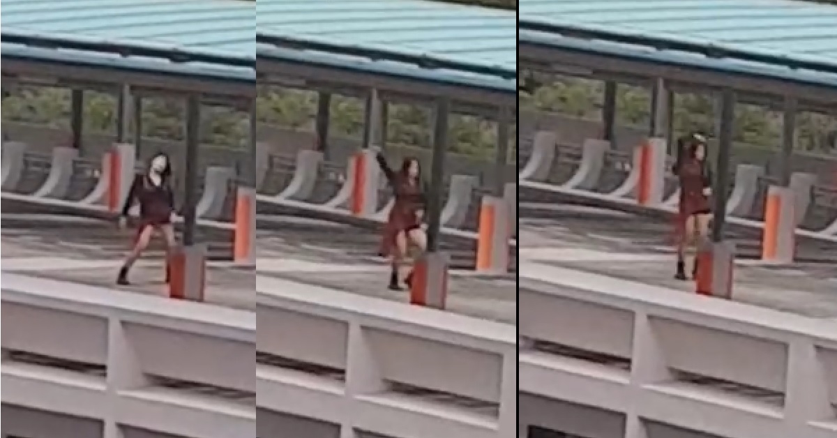 GIRL DANCING AND FILMING HERSELF AT HOLLAND CARPARK ROOF