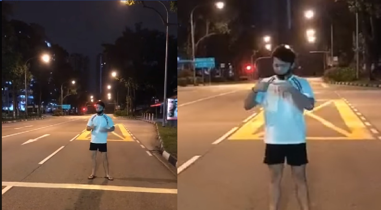 YOUNG PUNK TAKING TIKTOK VIDEO IN THE MIDDLE OF THE ROAD DURING CB PERIOD
