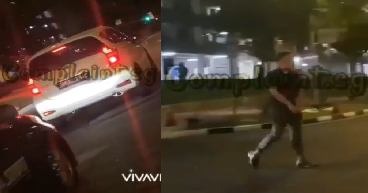 GUY BLOCKS TRAFFIC BY STOPPING HIS CAR IN THE MIDDLE OF THE ROAD