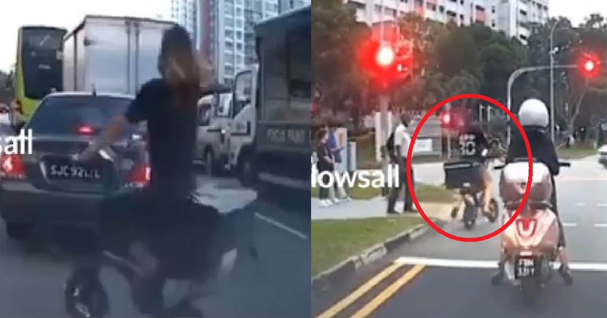 CYCLIST CYCLING ON THE ROAD WITHOUT HELMET TO SHOW OFF HER LONG, BEAUTIFUL HAIR