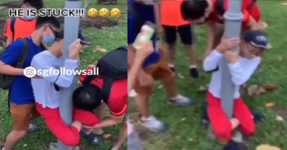 YOUNG PUNK CROSSES HIS LEGS WHILE HUGGING STREET LAMP, BECOMES STUCK