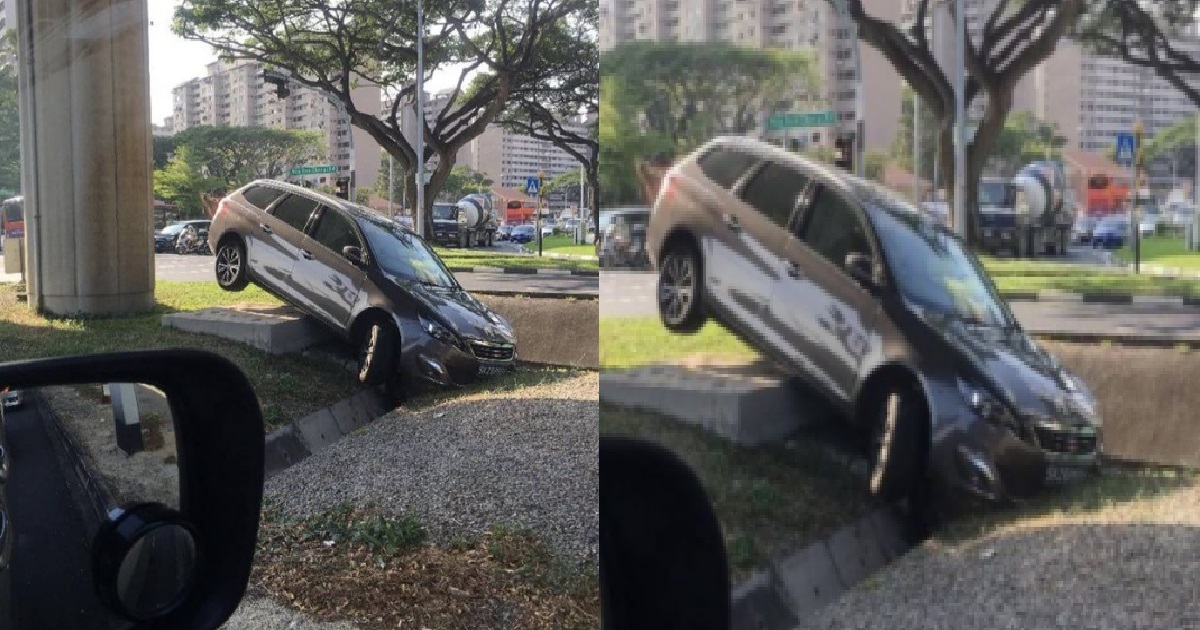 CAR SEEN CRASHED INTO LONGKANG BESIDE ROAD