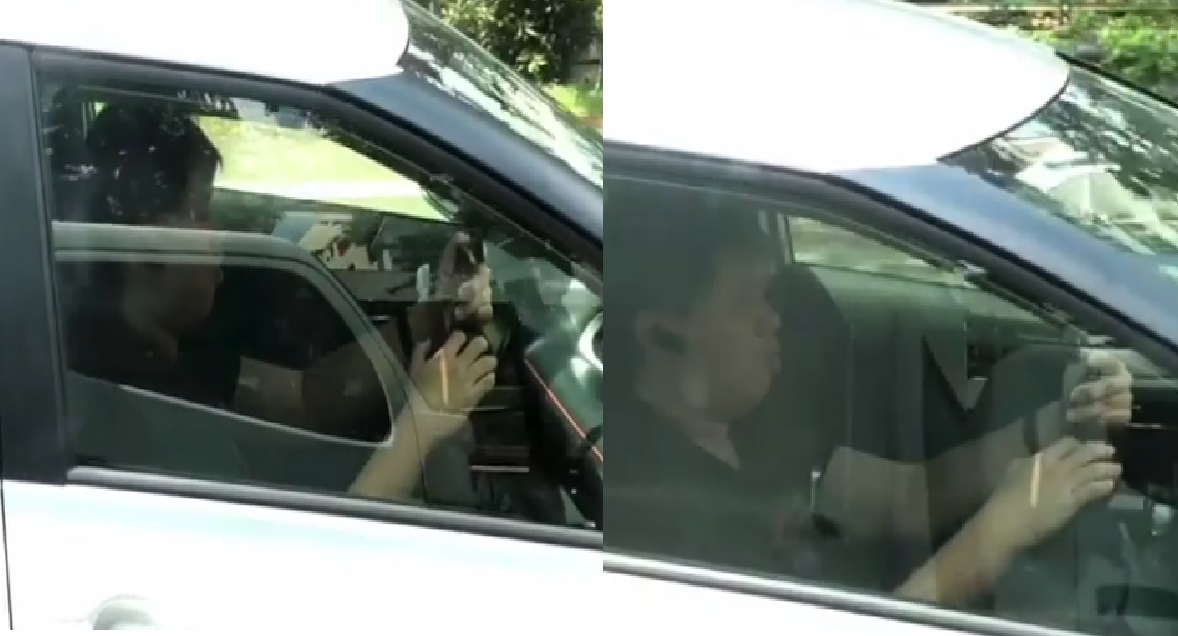 DRIVER SEEN USING HIS PHONE WHILE DRIVING, NOT LOOKING AT THE ROAD