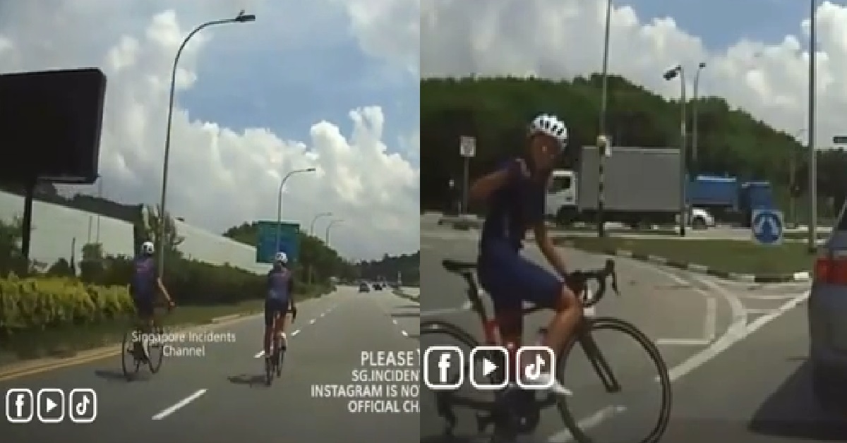 CYCLISTS IN MIDDLE OF ROAD ARGUING WITH DRIVER AT RED LIGHT