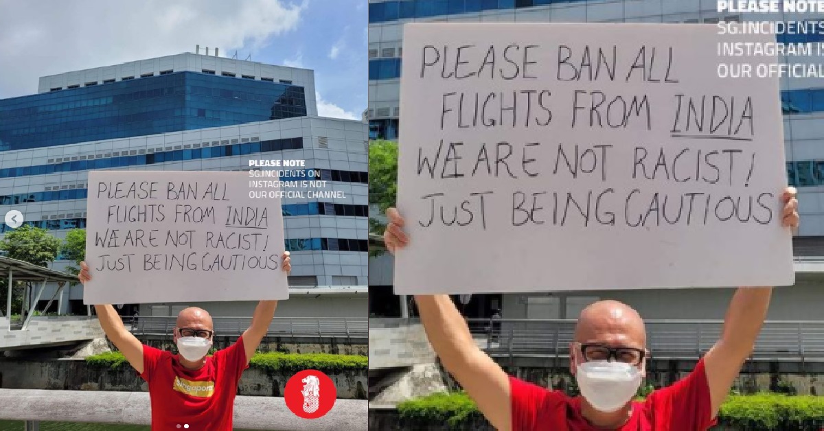 GUY HOLDS SIGN, ASKING FOR ALL FLIGHTS FROM INDIA TO BE BANNED, “WE ARE NOT RACIST”