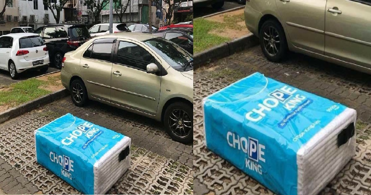 DRIVER CHOPE PARKING LOT WITH A GIANT PACKET OF TISSUE
