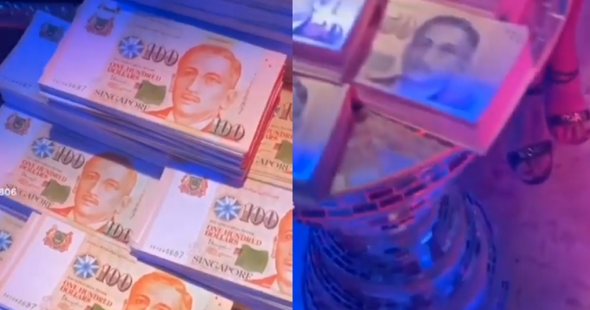 YP SHOWS OFF STACKS OF COUNTERFEIT S’PORE MONEY TO HOSTESSES AT KTV NIGHTCLUB