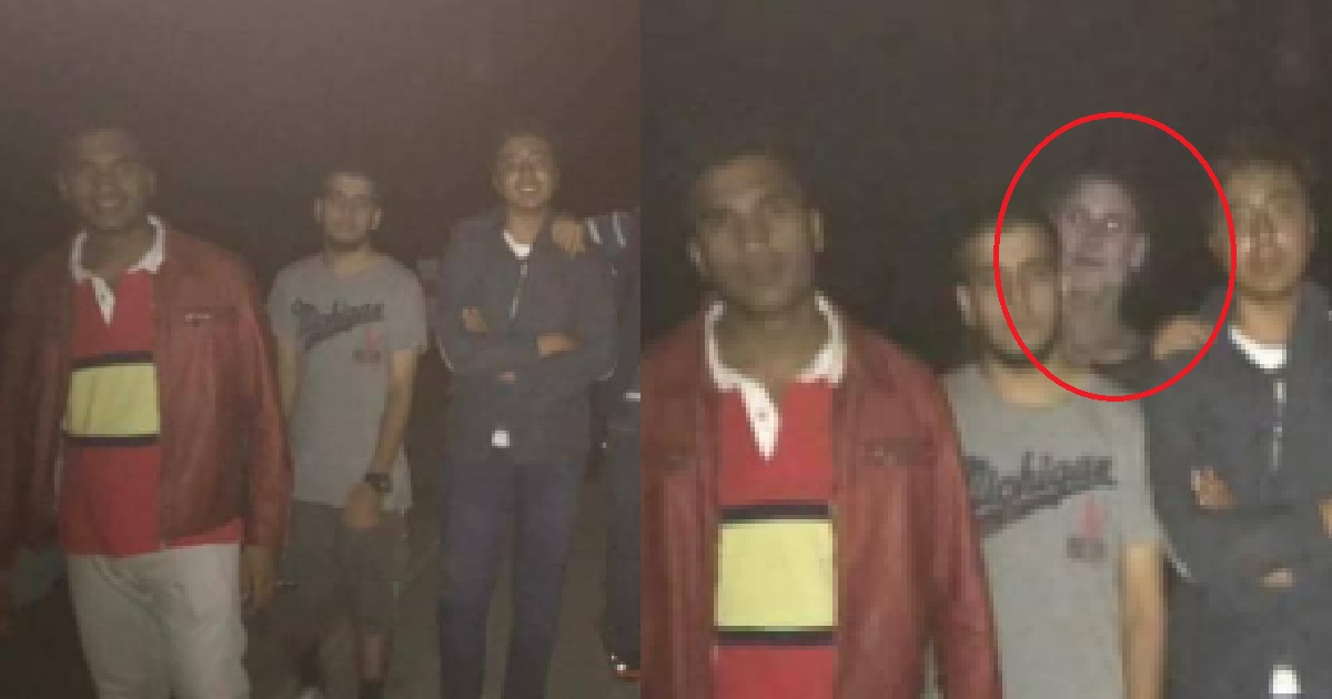 FRIENDS TAKING GROUP PHOTO, ACCIDENTALLY CAPTURE GHOST BEHIND THEM