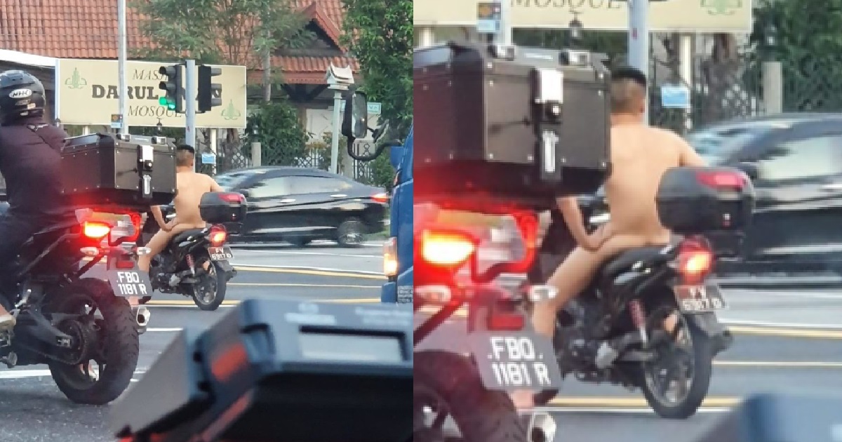 N*KED MAN RIDING HIS MOTORCYCLE ON THE ROAD AT EUNOS