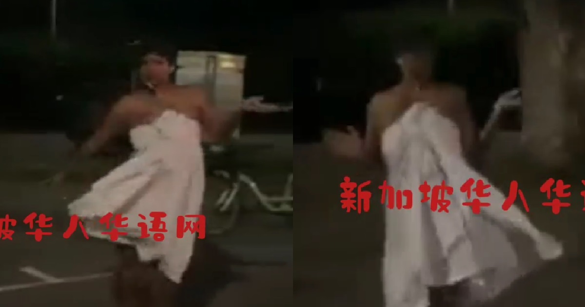 WOMAN WRAPPED IN JUST A TOWEL, DANCING IN MIDDLE OF ROAD