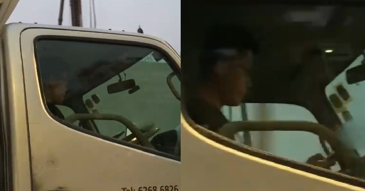 LORRY DRIVER HAPPILY USING PHONE WHILE DRIVING, NOT LOOKING @ ROAD