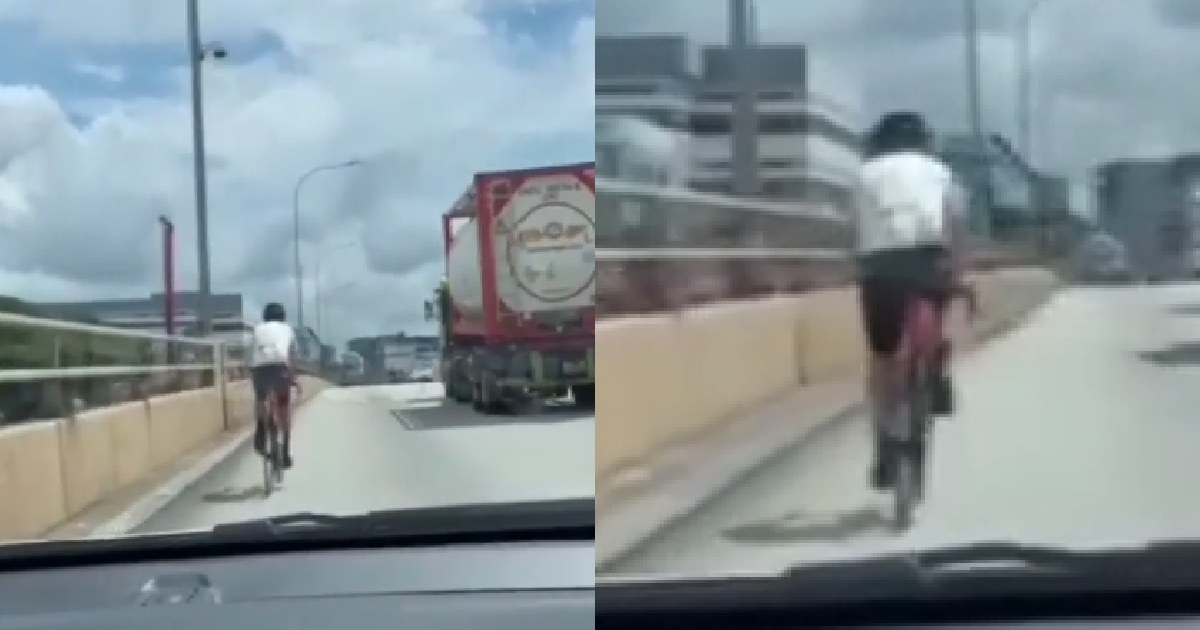 ERRANT CYCLIST RIDING ON EXPRESSWAY, CAR STUCK BEHIND HIM
