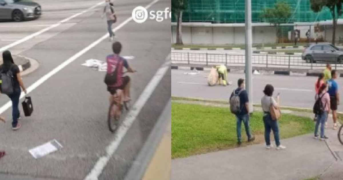 YP THROW NEWSPAPERS ON ROAD FOR CLEANERS TO PICK UP IN HEAVY TRAFFIC