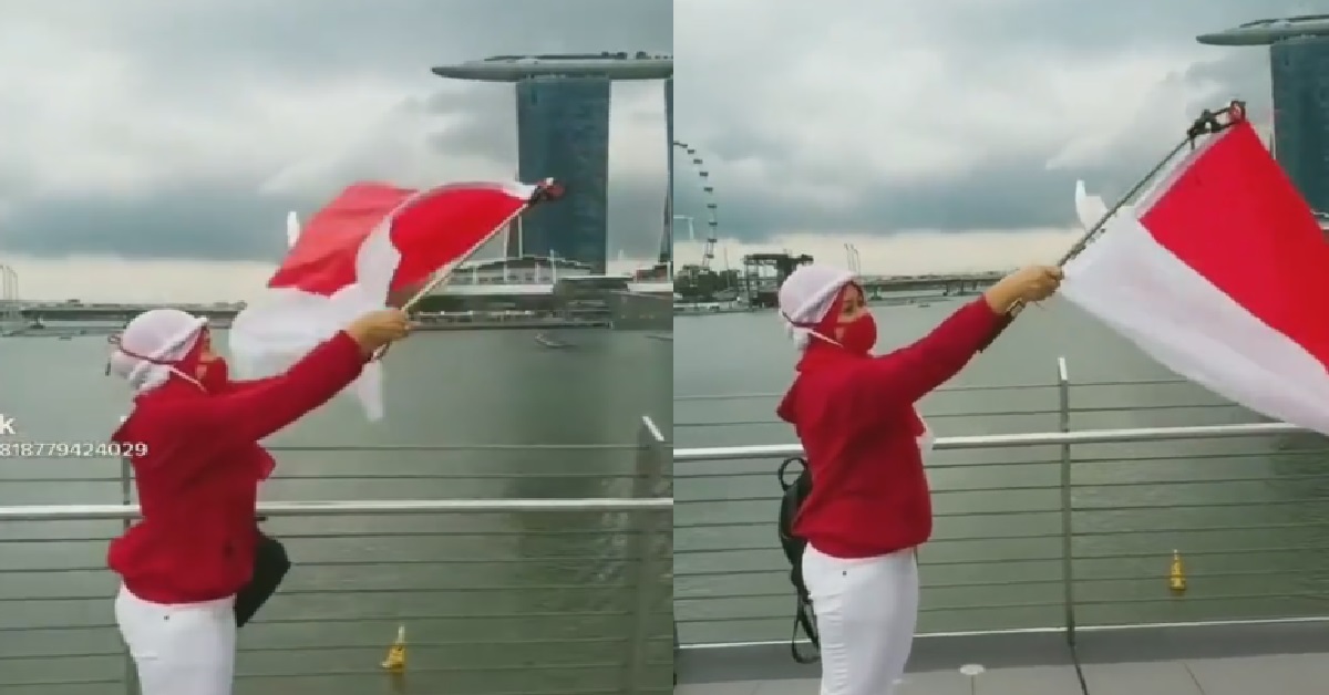 WOMAN WAVING WRONG FLAG FOR NATIONAL DAY @ MARINA BAY, WAVE INDONESIA FLAG