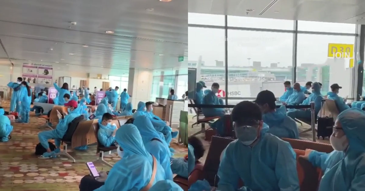 PASSENGERS AT CHANGI WEAR PPE BEFORE FLIGHT TO VIETNAM