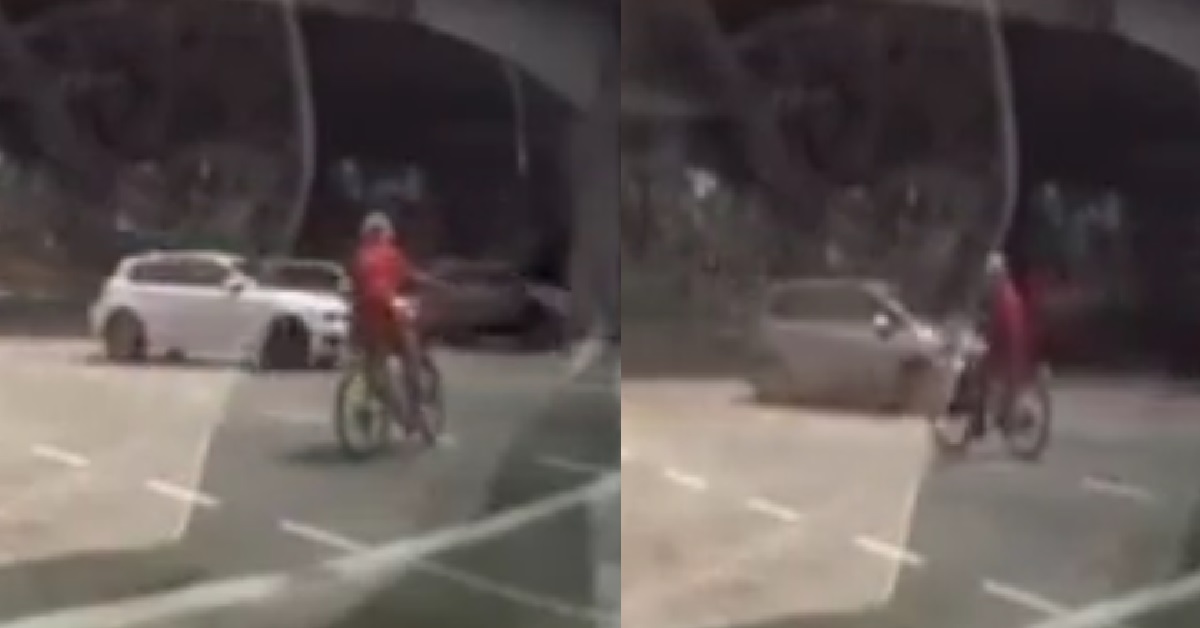 CRAZY CYCLIST RIDING IN CIRCLES IN MIDDLE OF ROAD JUNCTION