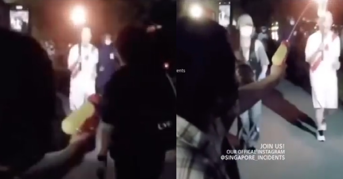 JAPAN OBASAN TRYING TO PUT OUT OLYMPIC TORCH WITH WATER GUN